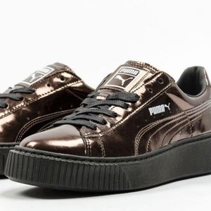 Bronze and black platform Puma sneakers